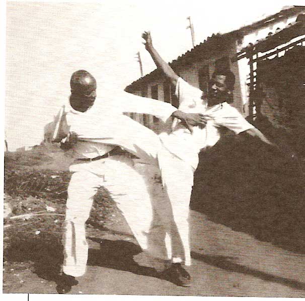 Mestre Bimba performing Banda, a Capoeira takedown